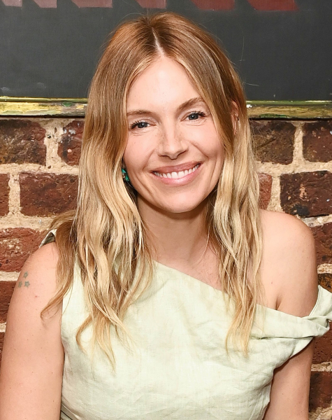 Sienna Miller wearing an off the shoulder top